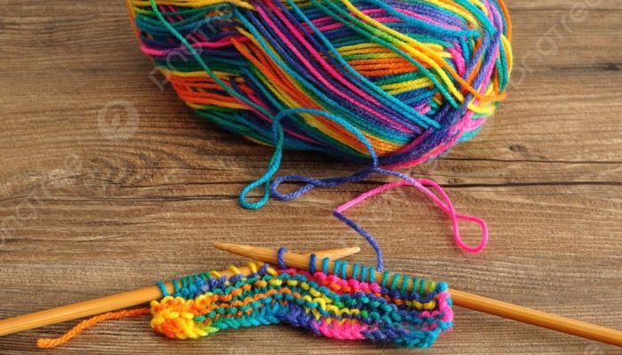 pngtree-a-ball-of-wool-with-knitting-needles-and-a-little-bit-picture-image_2841212